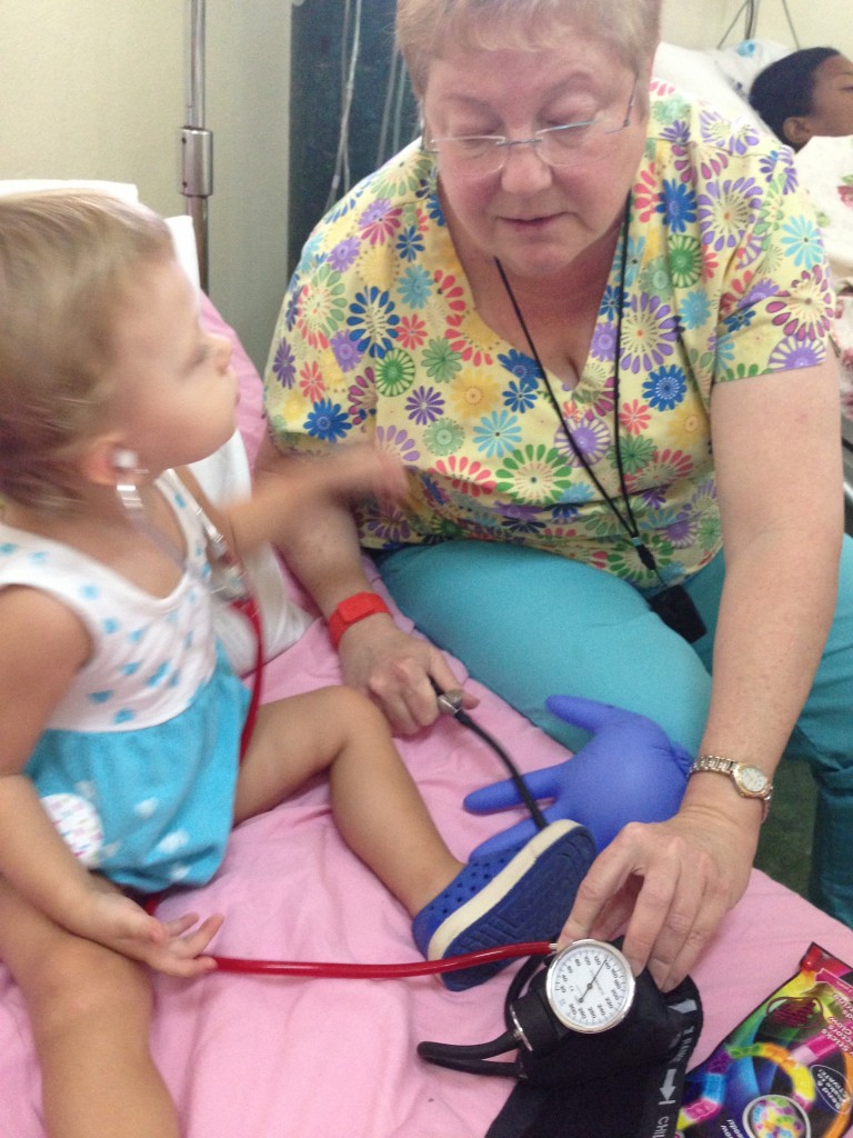 Checking the blood pressure on her balloon face